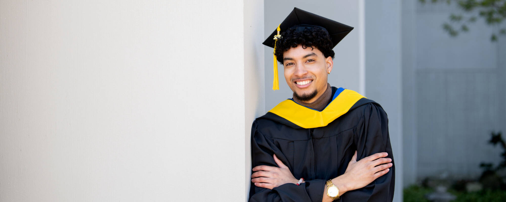 Graduate student in his cap and gown.